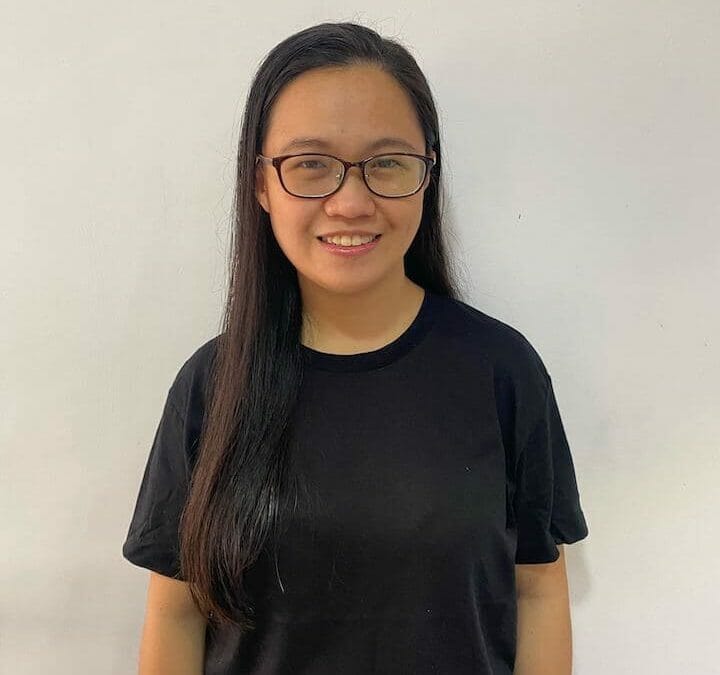 Aezel Santillana, Results Digital team member, headshot wearing glasses